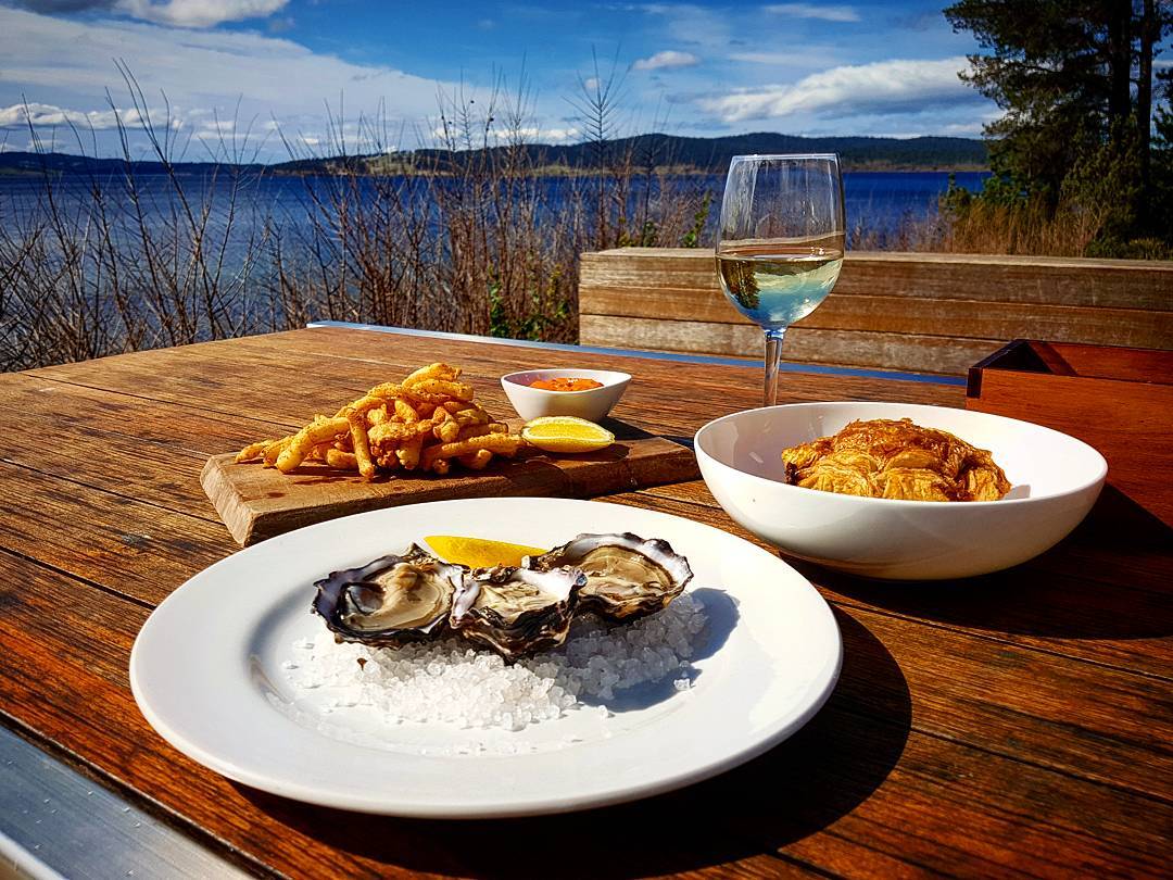 Delicious spread consisting of freshly shucked tasmanian oysters, semolina crusted squid with red pepper sugo and a pork and lambs heart pie served on a parsnip puree with jus. Topped of with a glass of @stefano_lubiana_wines Primavera Chardonnay. Perfect. ?: @sandy_mckay92 #tasmania #tasfoodie #tasmanianwine #stefanolubiana #oysters #squid #pie #paradise
