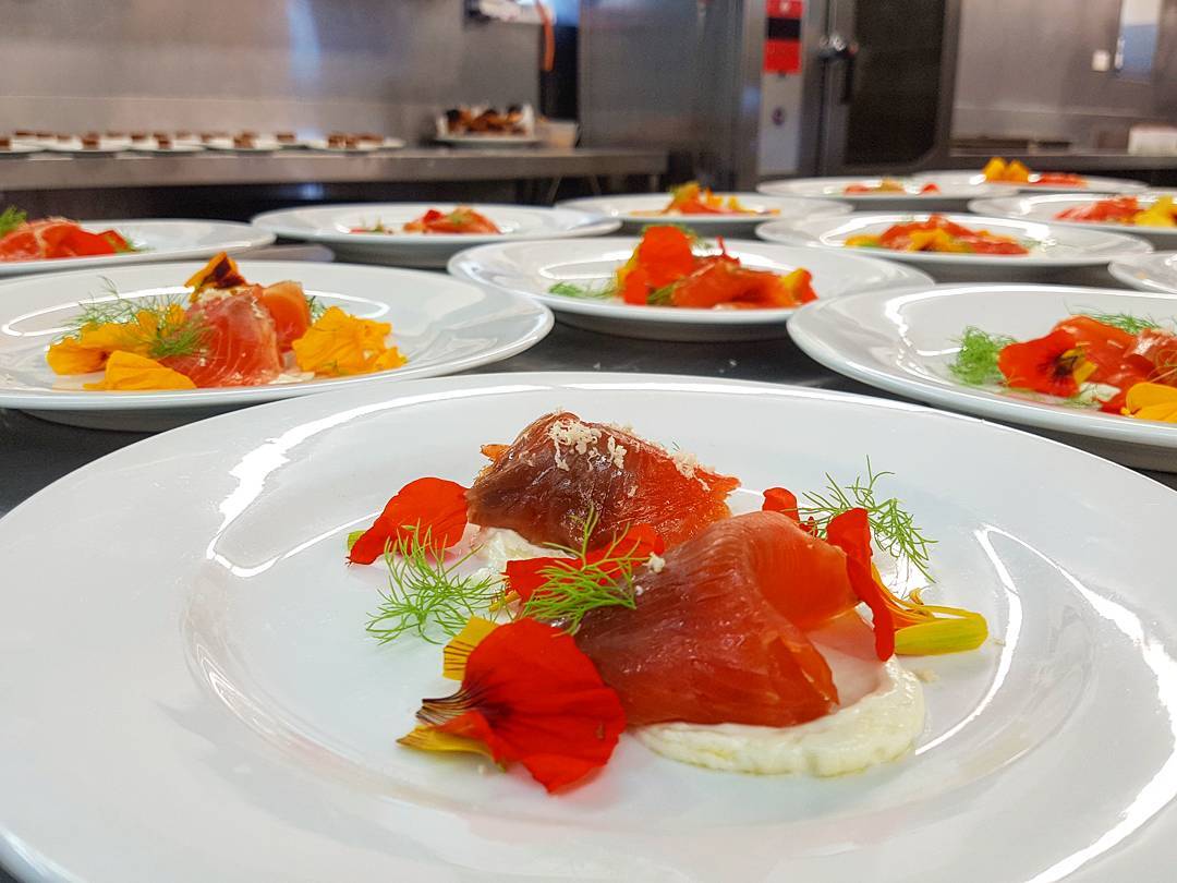 Vibrant starters for our lunch cruise guests today. @the_woodbridge_smokehouse ‘s cold smoked trout served with infused Labneh and  freshly picked garden flowers. @behrens_93 ?: @sandy_mckay92 #peppermintbay #woodbridge #tasmania #labneh #trout #flowers #kitchen