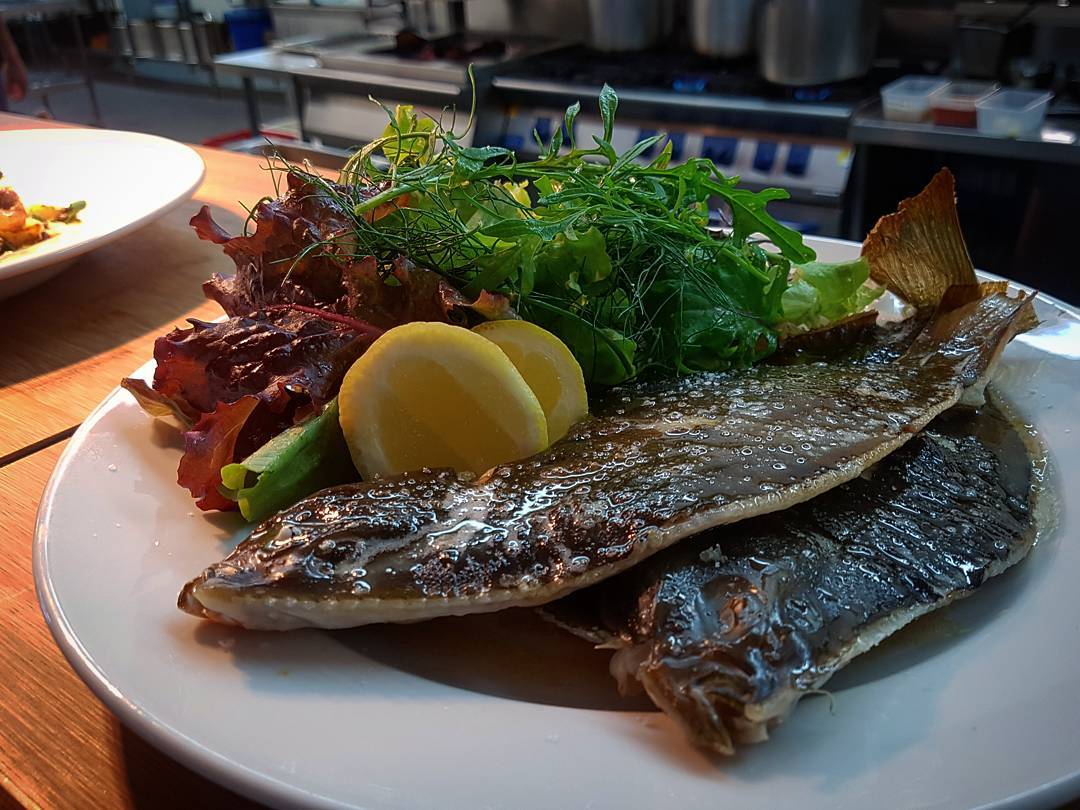 On tonights specials: baked whole flounder with burnt butter sauce, lemon and dressed garden greens ?: @sandy_photography #woodbridge #peppermintbay #tasmania #flounder #seafood #fresh #localproduce #homegrown #fromthegarden #tasmanianfood