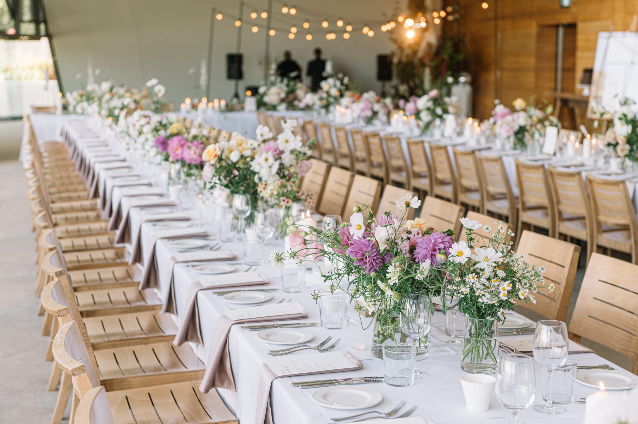 Two long wedding tables set with florals