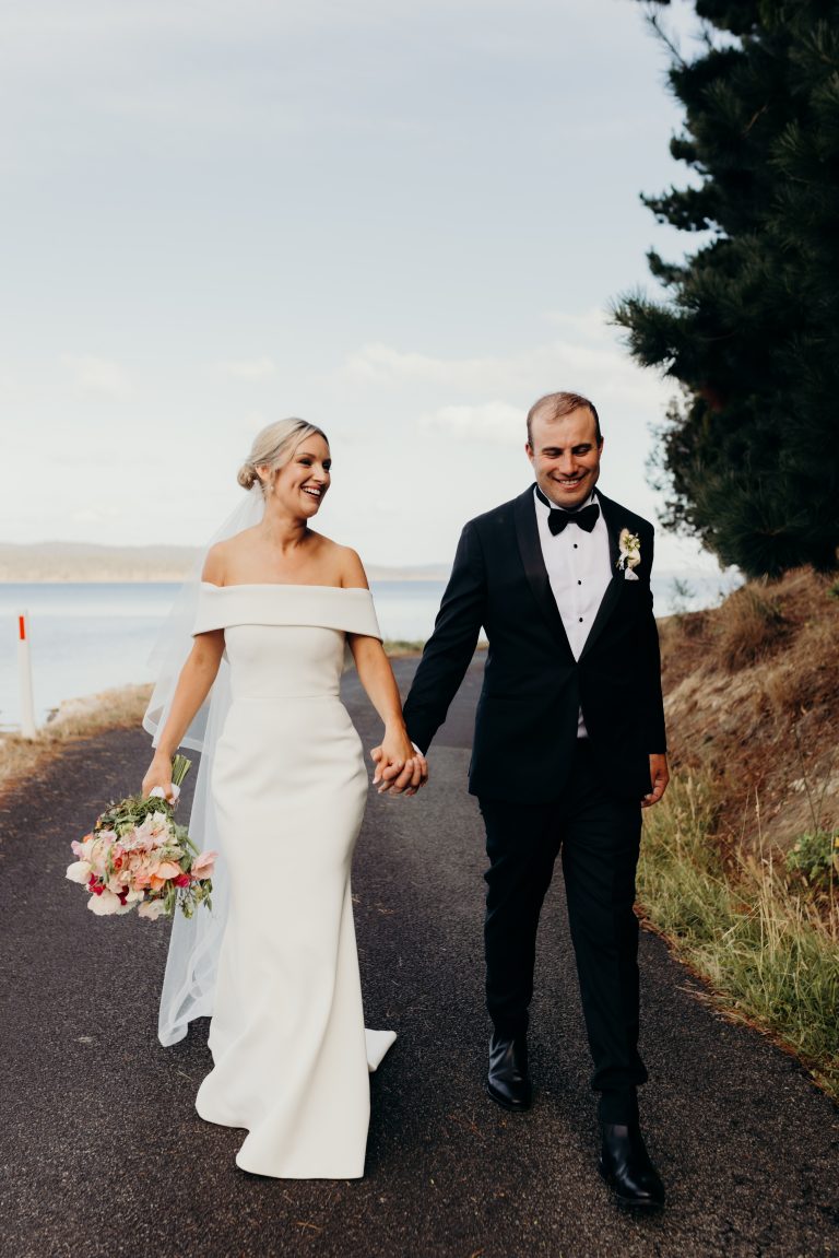 Bride and groom walking hand in hand